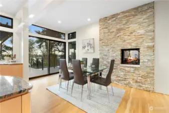 Informal dining area in the kitchen with view deck and firepace.