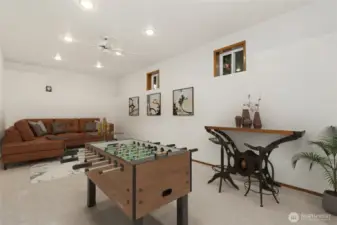 Game room is virtually staged.