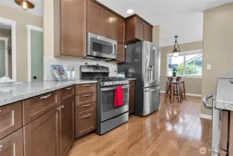 The cook will love the updated kitchen with quarttz counters, stainless steel appliances (stay), recessed lighting ...