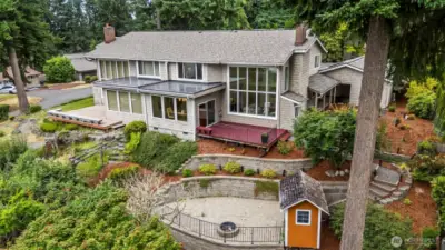 Lives like a townhouse / duplex with this unit on the right side, including the firepit area and garden shed.