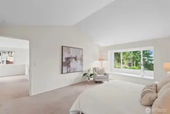 Spacious primary bedroom is very calming and serene.