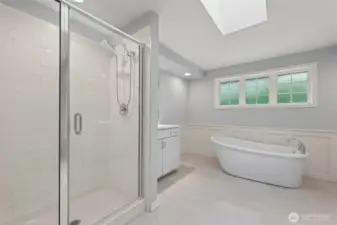 Primary ensuite creates a spa-like feel with calming colors & oversized skylight.