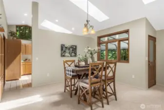 Enjoy the high ceilings and many skylights bringing in the natural light! Door from the dining room area leads to the beautiful sunroom directly off this area.