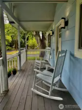 Rocking chair front porch perfect for coffee, friends, a good book or to simply enjoy a day in the neighborhood.