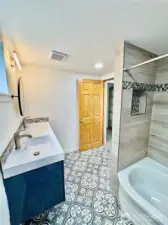 Full bathroom with double sinks upstairs.