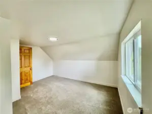 One of two bedrooms upstairs along with a  bonus/flex   room.