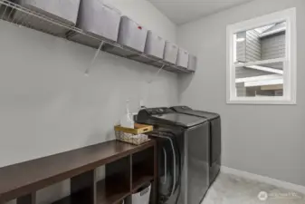 Another generous sized laundry room with natural light.