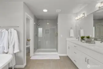 Luxurious primary suite is a true retreat.
