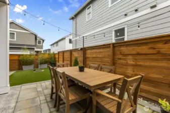 A cozy outdoor living area makes it easy to kick back with a book, sip your morning coffee, or host friends for a BBQ.