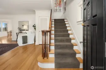 Eye-catching details welcome you inside such as the  original wood banister.