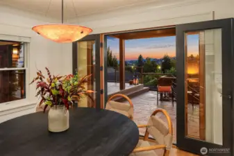 Dining room was remodeled to add new windows and French doors out to a magnificent deck, perfect for watching sunsets or hosting friends.