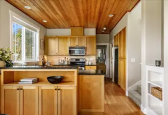 Maple cabinets, built-ins and elegant granite countertops bring a sense of luxury to this space.