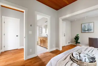 Looking from the primary into the main bathroom, ingeniously connected to the primary and the main floor.