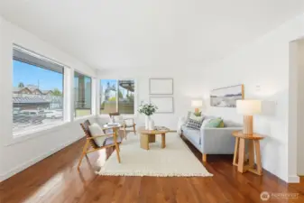 Located on the main floor of a well-maintained complex, this inviting home features a cozy open layout with a warm wood-burning fireplace, an eat-in kitchen, and abundant natural light.