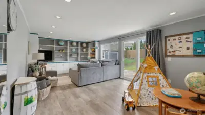 Playroom/Rec room/TV room. Sliding glass door goes out to the back patio