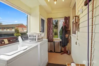 The newer washer and dryer are conveniently located in the back entry porch room.