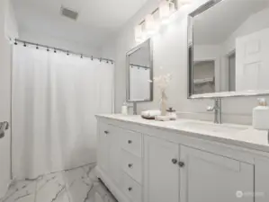 En suite has brand new vanity, flooring and lighting.