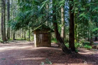 Pump house for shared well with neighboring property
