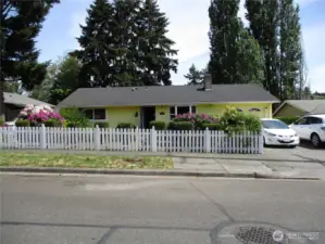 Welcome home! Mature landscaping and white picket fence!