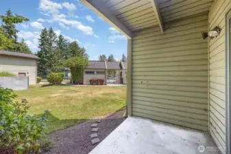 Step out through the sliding glass doors onto your private patio, which opens to a lush community lawn—just steps from the sparkling pool!
