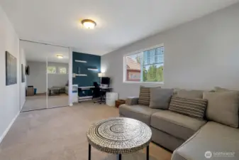 Huge 2nd bedroom with floating shelves and large windows