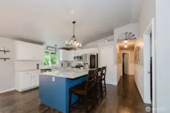 Oversized, custom island in kitchen, SS appliances, pantry, new granite countertops & tile backsplash. InstaView fridge included.