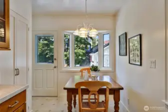 Breakfast nook to the rear door for quick access to the deck and patio. Makes entertaining easier!