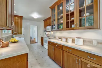 Looking towards the dining room. Enjoy the beautiful wood cabinets that are updated but consistent with the home's style.