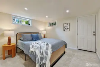 Lower level bedroom with rear door ingress and egress. New carpet.