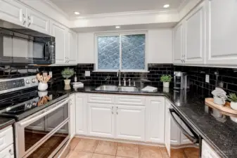 Sleek updated kitchen.  Bonus ....microwave exhaust vents to the exterior.