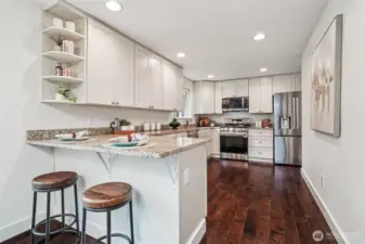 This stylishly appointed kitchen will please any chef, and the breakfast bar is perfect for coffee on the go during busy mornings.
