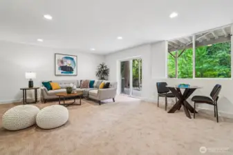 This spacious, bright and airy rec room is ready for movie and game nights!