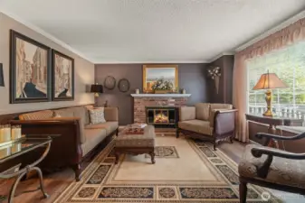 Light filled living room with fireplace.