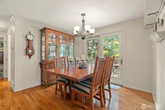 Dining room with doors that open to the entertainment sized rear deck.