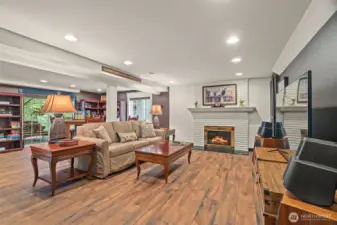 Lower level family room with fireplace. Plenty of room for entertaining or relaxing.