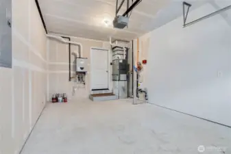Clean and tidy garage with tankless, on-demand water heater and furnace.