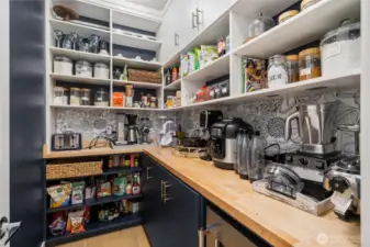 Any chef who loves to entertain will appreciate the kitchen’s updated quality Kitchen Aid appliances including double ovens and a gas range, a Samsung refrigerator, a large island with deep farmers-style sink, and incredible walk-in pantry with beverage cooler.