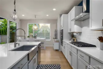 Any chef who loves to entertain will appreciate the kitchen’s updated quality Kitchen Aid appliances including double ovens and a gas range, a Samsung refrigerator, a large island with deep farmers-style sink, and incredible walk-in pantry with beverage cooler.