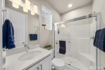 main level bedroom suite with a bathroom suite.