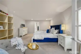 Upstairs, the expansive primary awaits, offering a large walk-in closet with organization and a lovely en suite bath with dual vanities, walk-in shower and soaking tub. Another bedroom connected through French doors could also be a nursery or large sitting room.