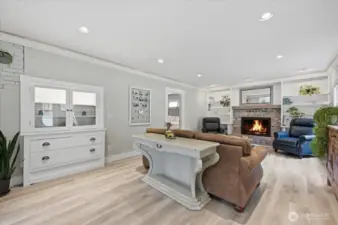 Built in cabinetry and shelves honor the 1926 styling. New luxury vinyl plank is practical and easy to care for.