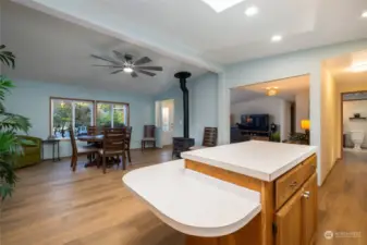 Cozy propane stove by the dining area.  New fixtures and hardware compliment the fresh paint and flooring.