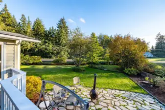 Back yard deck and patio area.  The neighbors have a dahlia garden in bloom to enjoy from the deck!