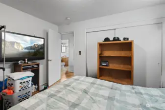 Another view of the second bedroom showing the double door closet.