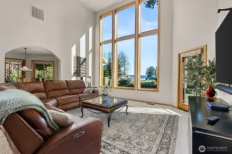 The great room is flanked with a wall of windows taking advantage of that sound and mountain view.