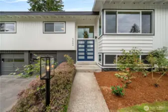 Stunning mid century curb appeal with fresh exterior paint and new front door.