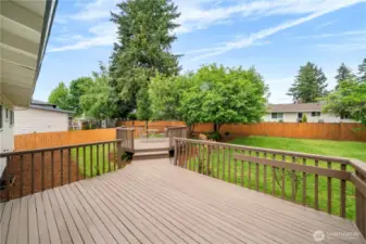 Spacious backyard deck ideal for entertaining.