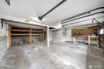 Large attached 2-car garage with tons of space for extra storage & tools.