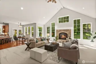 The kitchen and casual dining area sit adjacent to this cozy room making entertaining a breeze!
