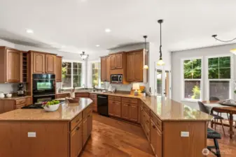Expansive slab countertops in this gourmet kitchen make hosting large gatherings a breeze. There's plenty of space for everyone to join in—whether baking cookies with loved ones or preparing festive holiday meals together.